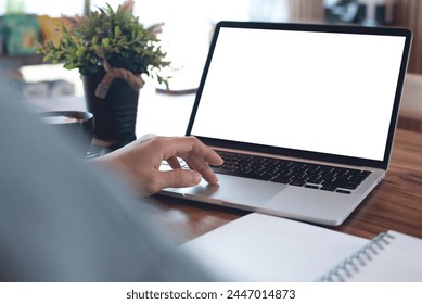 Mockup blank screen laptop computer. Business woman working on laptop computer at home office, planning work project on notebook. Student studying online via laptop, template for online marketing - Powered by Shutterstock