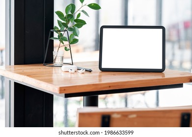 Mockup Blank Screen Tablet And Gadget On Wooden Table.