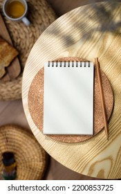 Mockup Blank Sprial Notebook Top View On Wood Table With Morning Sunlight And Breakfast