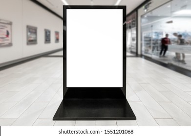 Mockup Of Blank White Vertical Indoor Advertising Poster Stand With Black Frame In Shopping Centre Or Mall