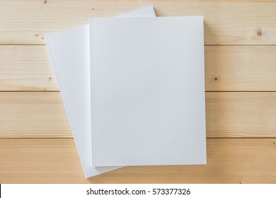 Mock-up Book Cover Blank A4 Size Paperback Mockup For Catalog, Magazine Booklet, Portfolio, Menu Design Template With Page Front Side On White Surface On Wood Table