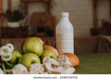 mockup bottle with kefir, milk and green apples in a wooden kitchen. High quality photo