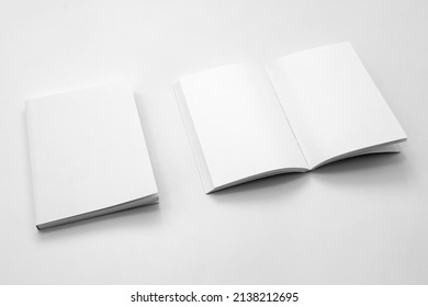 Mockup Of Brochure With Fold. Blank Mock Up Of Booklet, Menu And Book. White Paper Of Magazine. Mockup Of Leaflet. Template Of Twofold Pamphlet Isolated On White Background