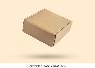 Mockup brown cardboard box isolated on brown background