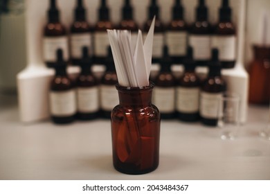 Mockup Brown Glass Bottle With Blotter Paper For Testing Smell Of Essential Oil And Fragrance Oil. Perfume Tester Paper Strips.