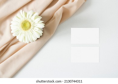 Mockup Business Card With Gerbera Leaves On The White Background