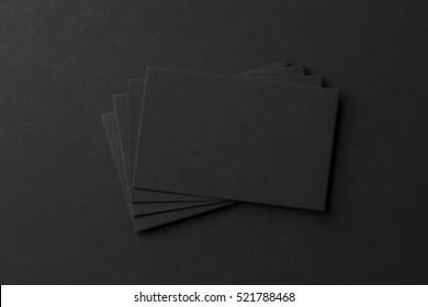 Mockup Of Business Cards Fan Stack At Black Textured Paper Background.