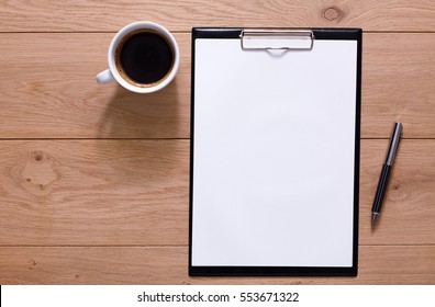 Mockup for check list, empty note paper with pen and coffee cup on brown wood background. Office, writer or study concept