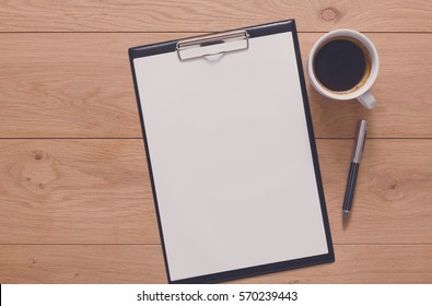 Mockup For Check List, Empty Note Pad Paper With Pen And Coffee Cup On Brown Wood Background. Office, Writer Or Study Concept