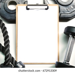 Mockup Clipboard With Gym Equipment Dumbbell And Weights Plate.