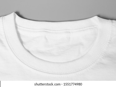 Mockup Of Close Up Perspective White Blank T-shirt Template In Studio Photo Shoot On Grey Background