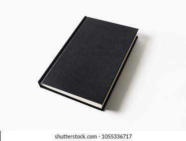 Mockup Of Closed Blank Black Book At White Paper Background.