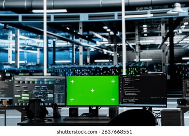 Mockup computers in data center facility used for managing supercomputers hardware energy consumption. Green screen PCs used for automation and monitoring processes in server farm