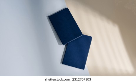 Mockup of dark blue business notepad in leather cover without logo. A5 diary