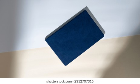 Mockup of dark blue business notepad in leather cover without logo. A5 diary