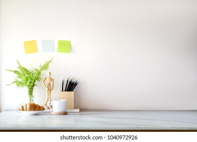 Mockup Desk Space With Coffee, Snack And Supplies. Front View And Copy Space