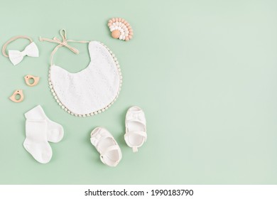 Mockup Of Empty Frame With White Baby Accessories. Baby Shower, Baptism Invitation