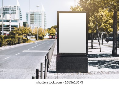 Mockup Of An Empty Information Poster In Urban Settings Near A City Road; A Blank Vertical Street Banner Template On The Sidewalk In Alleyway; An Outdoor Billboard Placeholder Mock-up Near The Highway