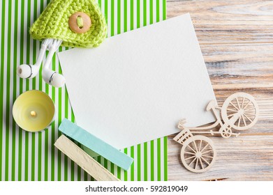 Mock-up, empty paper note, green chalk, earphones and decoration view from above