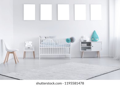 Mockup Of Empty Posters Above Cradle In White Baby's Room Interior With Chair And Carpet. Real Photo