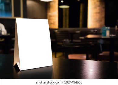 Mockup Empty White Label Menu Frame On Table With Cafe Restaurant Interior Background