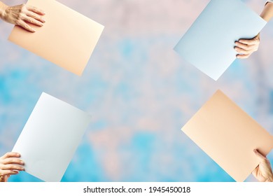 Mockup Of Female Hands Holding Different Empty Colored Cardstock. Copy Space