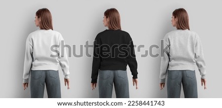 Mockup of a female sweatshirt, white, black, heather crop shirt on a slender girl in gray jeans, back view, for design, print. Blank apparel template, isolated on background, for advertising. Set wear
