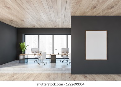 Mockup frame canvas in wooden black office room with minimalist furniture, table and wooden chairs and computers. Manager consulting room with modern furniture and plant, 3D rendering no people - Shutterstock ID 1922693354