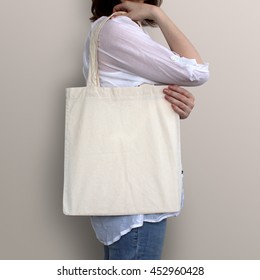 Mock-up. Girl Is Holding Blank Cotton Tote Bag.