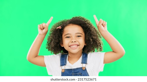 Mockup, green screen and child pointing up at product placement space isolated against a studio background. Excited, happy and portrait of young kid advertising and marketing showing deal or sale - Powered by Shutterstock