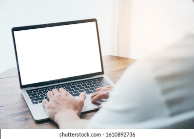 Mockup Image Blank Screen Computer With White Background For Advertising Text,hand Man Using Laptop Contact Business Search Information On Desk At Coffee Shop.marketing And Creative Design