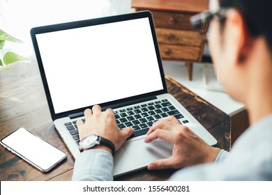 mockup image blank screen computer,cell phone with white background for advertising text,hand man using laptop texting mobile contact business search information on desk in office.marketing and design - Shutterstock ID 1556400281