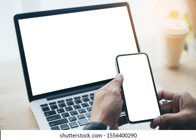 Mockup Image Blank Screen Computer,cell Phone With White Background For Advertising Text,hand Man Using Laptop Texting Mobile Contact Business Search Information On Desk In Office.marketing And Design