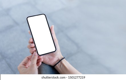 Mockup Image Blank White Screen Cell Phone.woman Hand Holding Texting Using Mobile At Outdoor In  The City. Background Empty Space For Advertise Text. Contact Business,people Communication,technology 