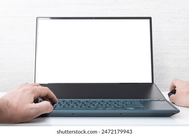 Mockup image of hand using laptop with blank white screen on a white background