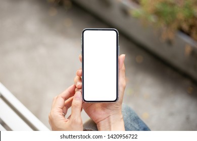 Mockup Image Screen Cell Phone.women Hand Holding Texting Using Mobile At Outdoor.copy Space,white Blank Screen For Text.concept For Contact Business,people Communication,technology Electronic Device