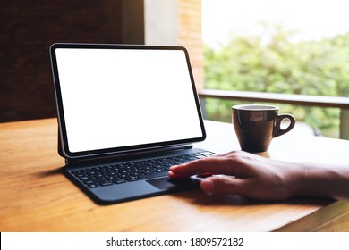 Mockup Image Of A Woman Using And Touching On Digital Tablet Touchpad With Blank White Desktop Screen As A Computer Pc