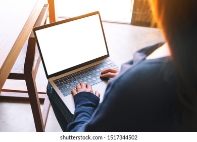 Mockup Image Of A Woman Using And Typing On Laptop Computer Keyboard With Blank White Desktop Screen 