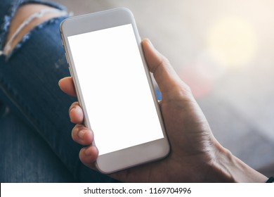 Mockup Image Of Woman's Hand Holding And Using White Mobile Phone At Outdoor With Copy Space,blank Screen For Text.concept For Business,people Communication,technology Electronic Device. Modern Life S