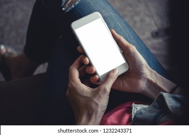 mockup image.woman hand holding texting white cell phone relax in workplace. concept for electric,communication device research world international modern business,techonology