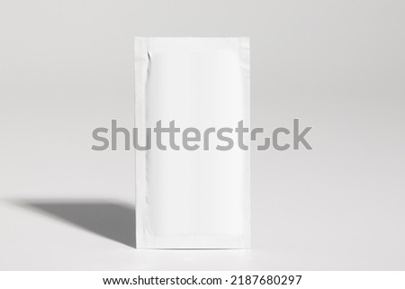 Mockup of isolated envelope of medicine, for powder, vertical, with blank label for packaging design, on white background, real photo studio, no 3D