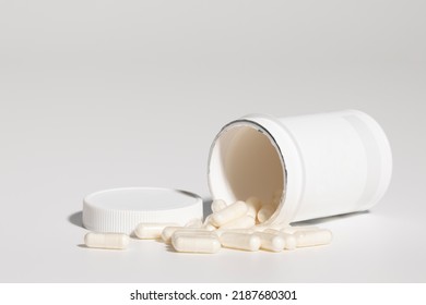 Mockup Of Isolated Opened Plastic Medicine Bottle, With Pills, With Screw Cap And Blank Label For Packaging Design, On White Background, Real Studio Photo Product, No 3D