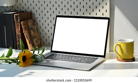 Mockup Laptop Computer, Coffee Cup And Sunflower On White Table.