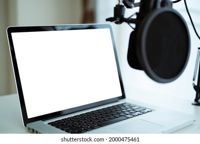 Mockup Laptop Computer With Empty Blank Screen Isolated With Clipping Path Set Up In The Audio Sound Recording Studio. Live Steaming And Podcast Internet Radio Studio.