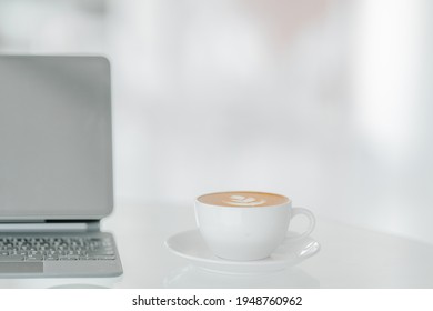 Mockup Laptop On White Desk With White Cup Late Latte Art