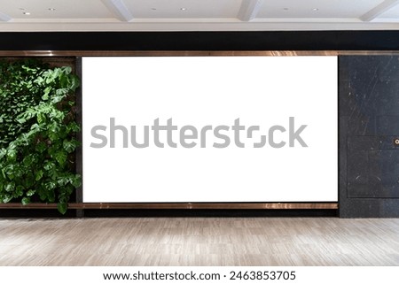 Mockup Large blank horizontal billboard on the wall with green leaves, Empty space for Advertising, Promotion in prominent position, Attract attention on corridor at shopping mall