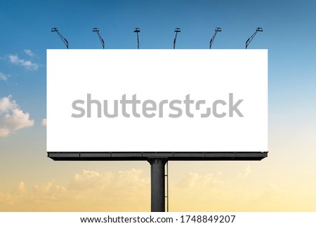 Mockup Large white blank billboard or white promotion poster displayed on the outdoor against the blue sky background. Promotion information for marketing announcements and details