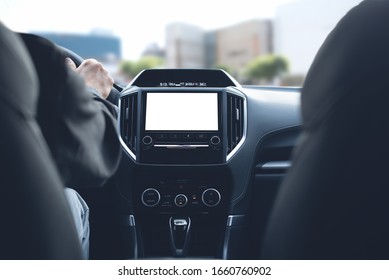 Mockup Of Lcd Blank Computer Dashboard Screen Of Modern Car, Man Driving A Car And Monitoring Navigation System, Locator Gps Map In The City, Close Up