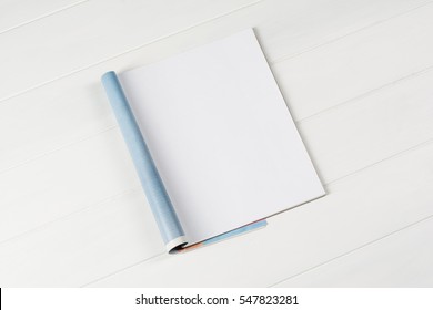 Mock-up magazine or catalog on wooden table. Blank page or notepad on wood background. Blank page or notepad for mockups or simulations. - Shutterstock ID 547823281