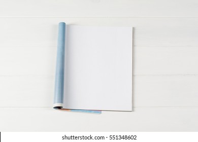 Mock-up magazine or catalog on wooden table. Blank page or notepad on wood background. Blank page or notepad for mockups or simulations. - Shutterstock ID 551348602